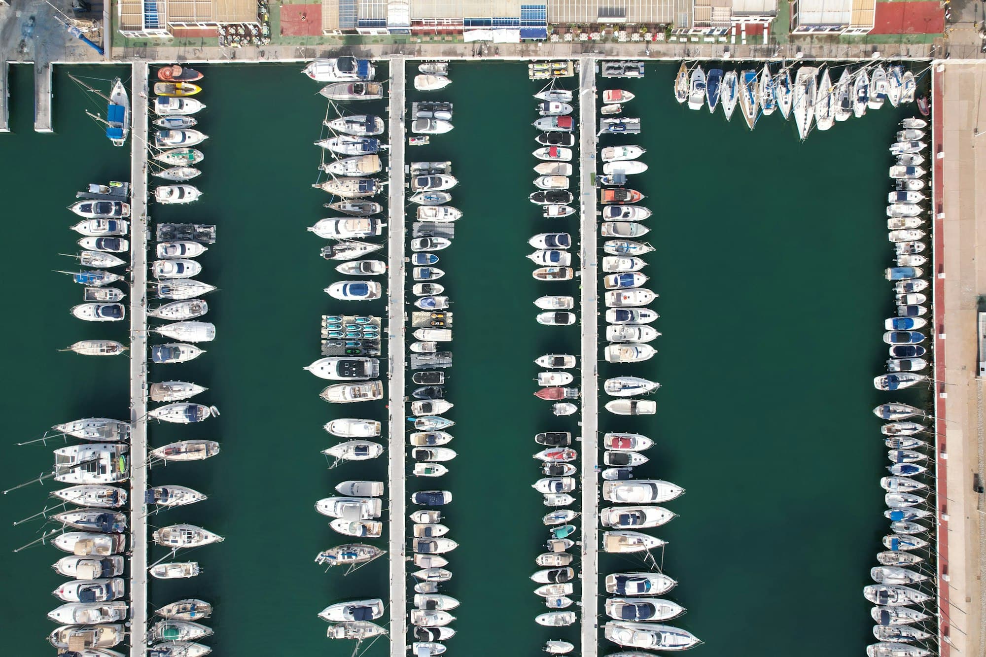 Aerial view of a marina filled with yachts