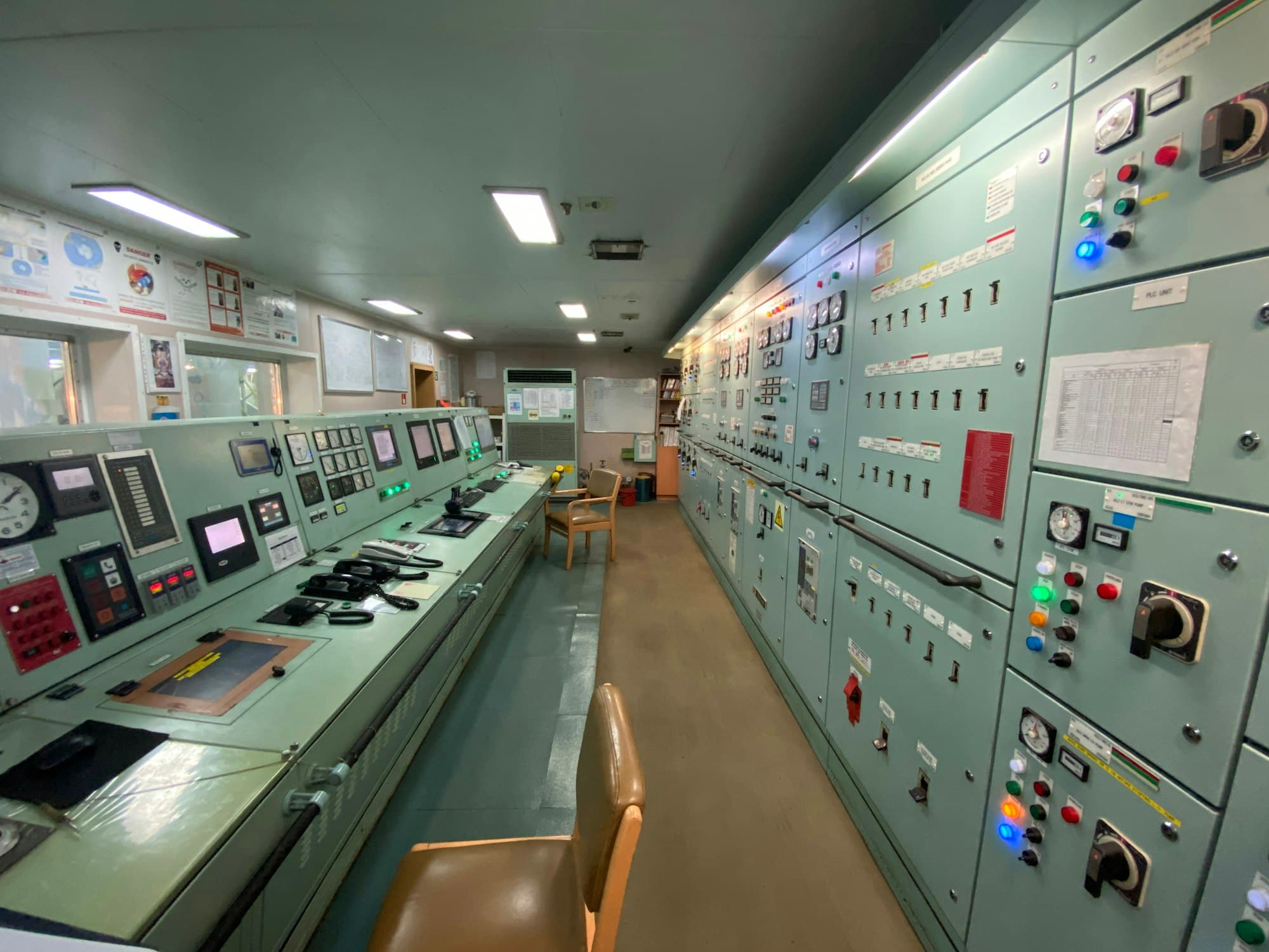 Onboard vessel systems control room with integrated panels