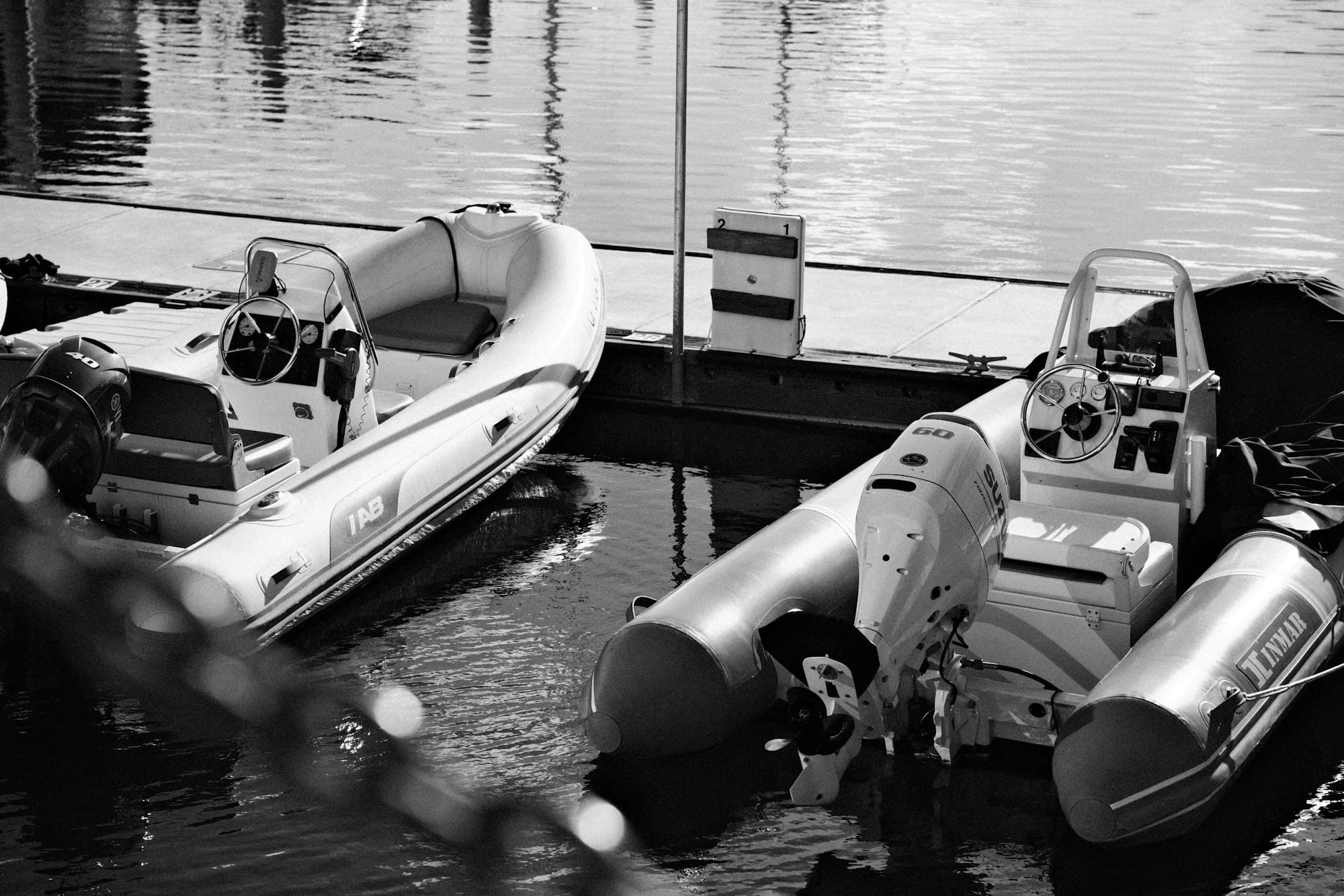 RIB superyacht tenders moored side by side at a marina